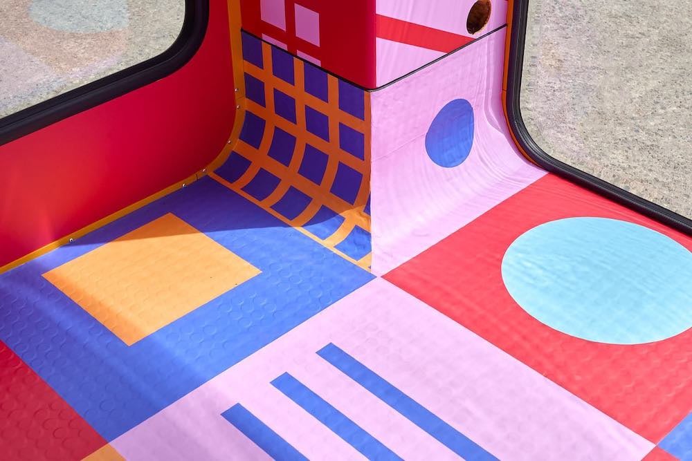 Dance floor in the disco cube, covered in bright colors and squares, circles and lines