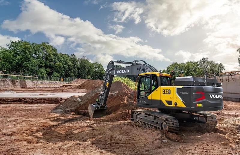 A Volvo EC230 electric excavator at work on a building site