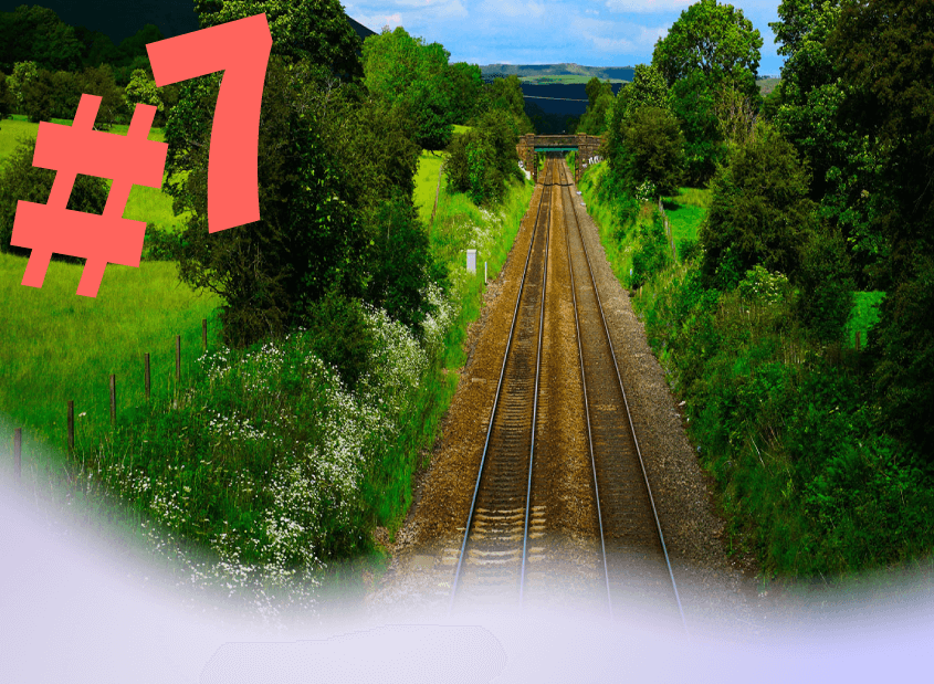 #7 Productivity Paradise - Train tracks through green countryside