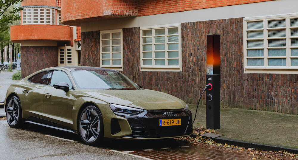 An Audi car plugged into an on-street Audi charger