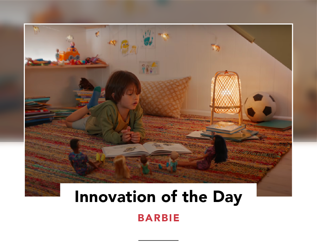 Screenshot from Barbie's ad, showing a child reading to a group of dolls