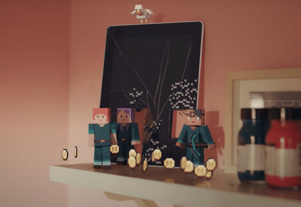 Minecraft characters with a busted iPad and freshly minted coins