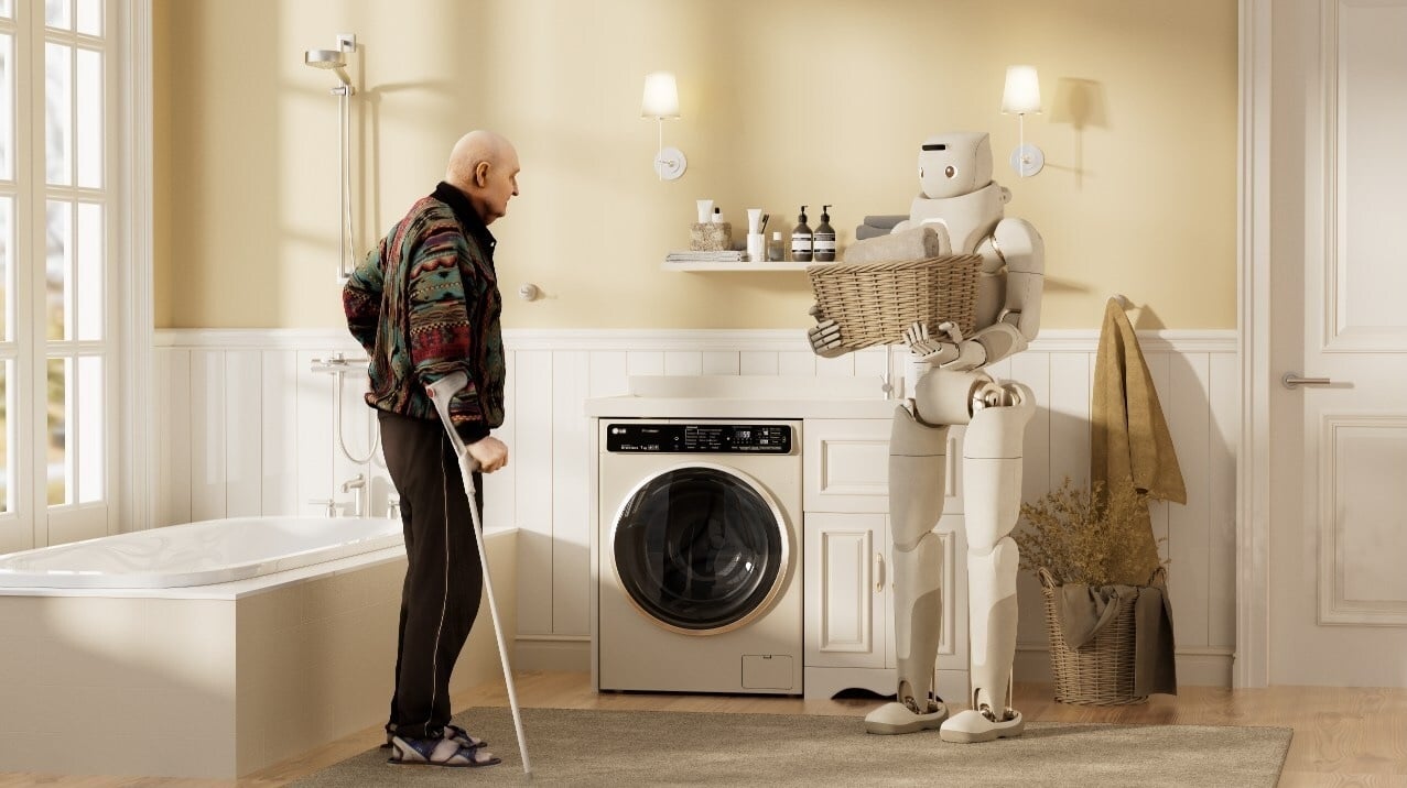 An elderly man with a cane stands in a bathroom facing a humanoid robot holding a laundry basket 