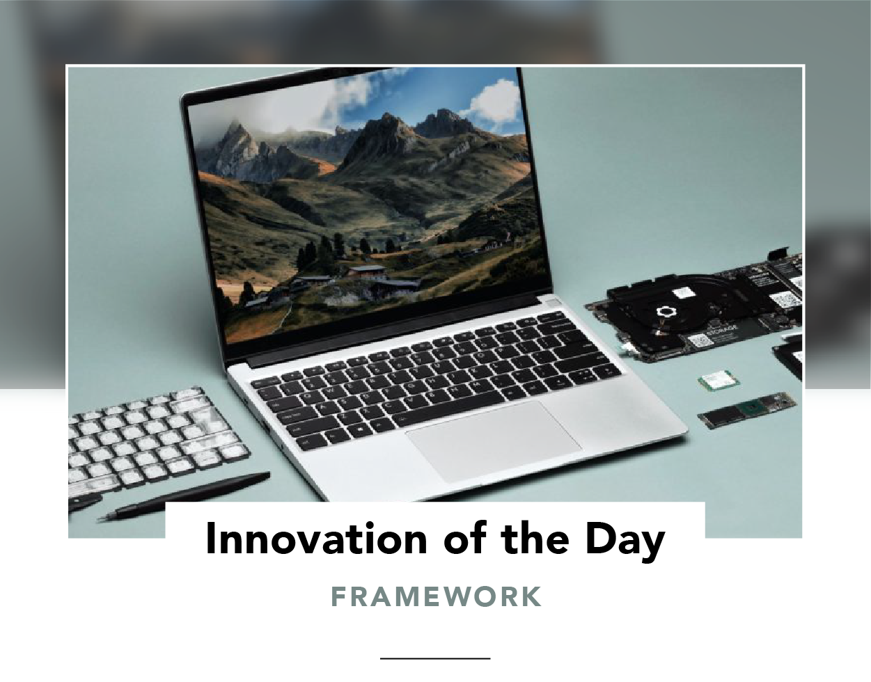 Framework laptop surrounded by a screwdriver and replaceable parts