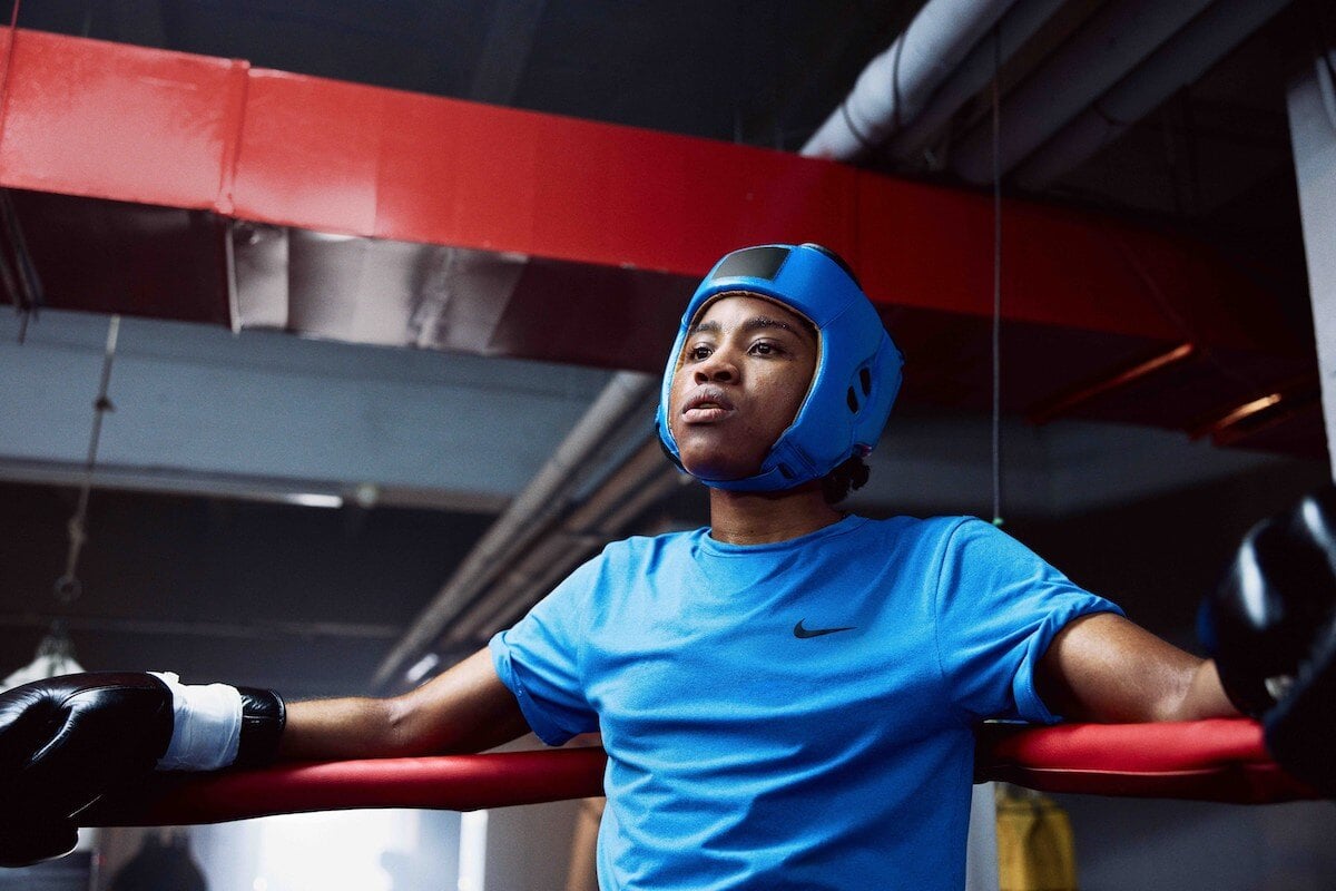 Boxer Cindy Ngamba photographed in the corner of a boxing ring 
