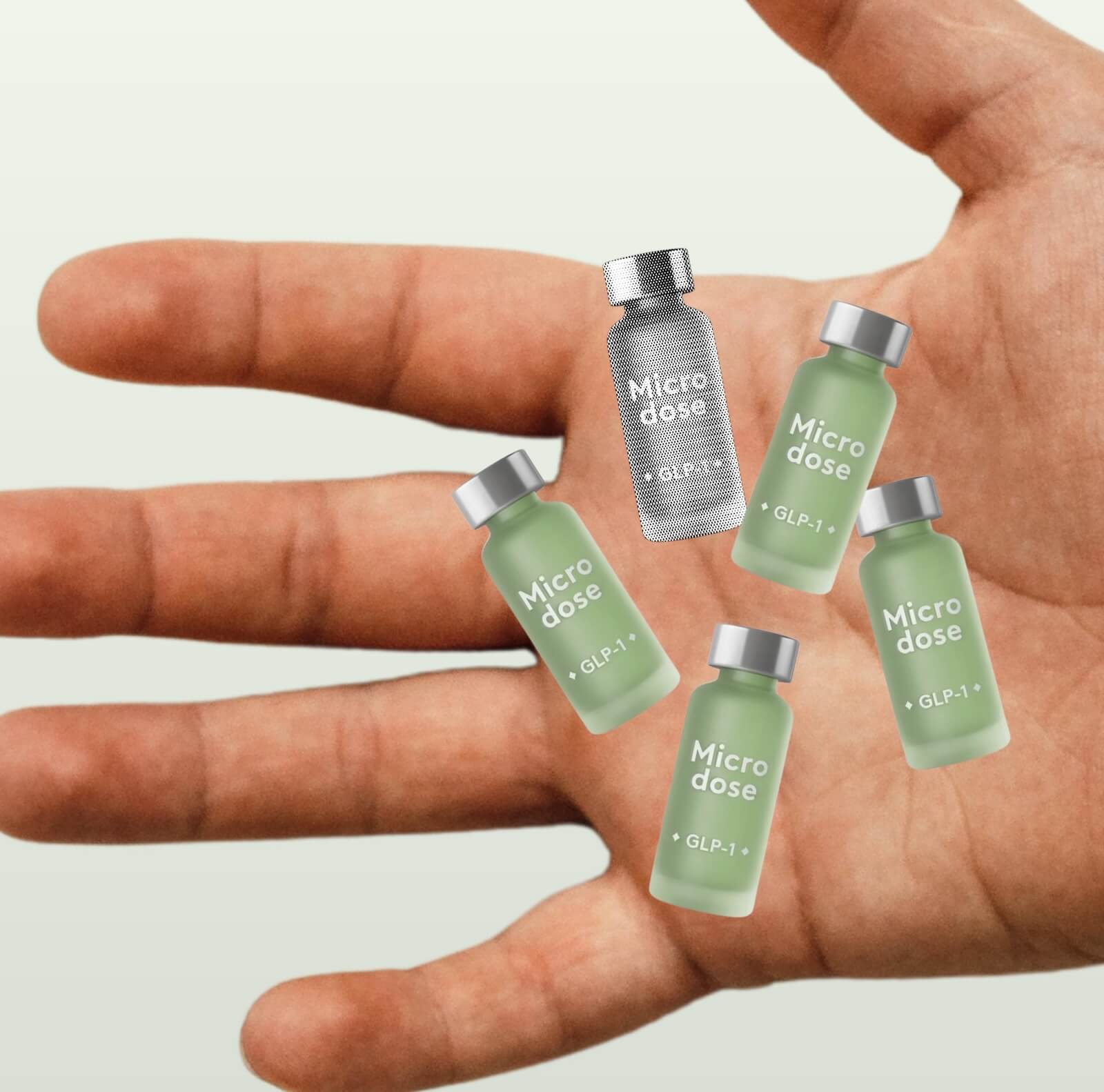 Open hand with five small vials labeled 'Micro dose GLP-1' 