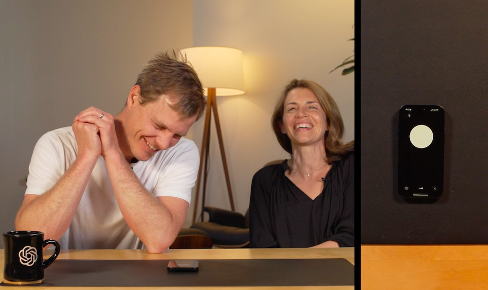 Still from an OpenAI video demo of GPT-4o, showing two people laughing 