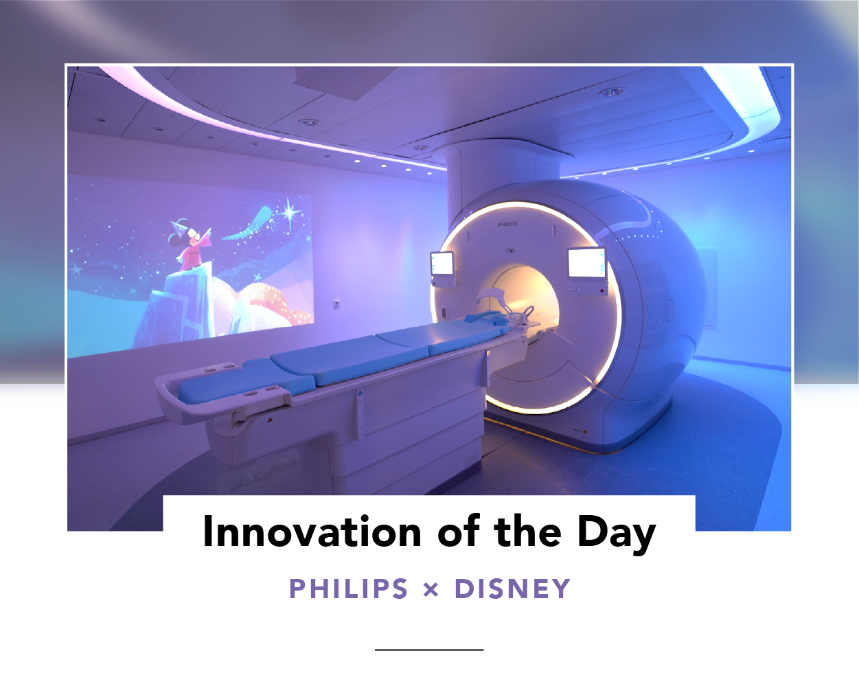Exterior view of an MRI scanner with soft, ambient lighting and Mickey Mouse projected on a wall