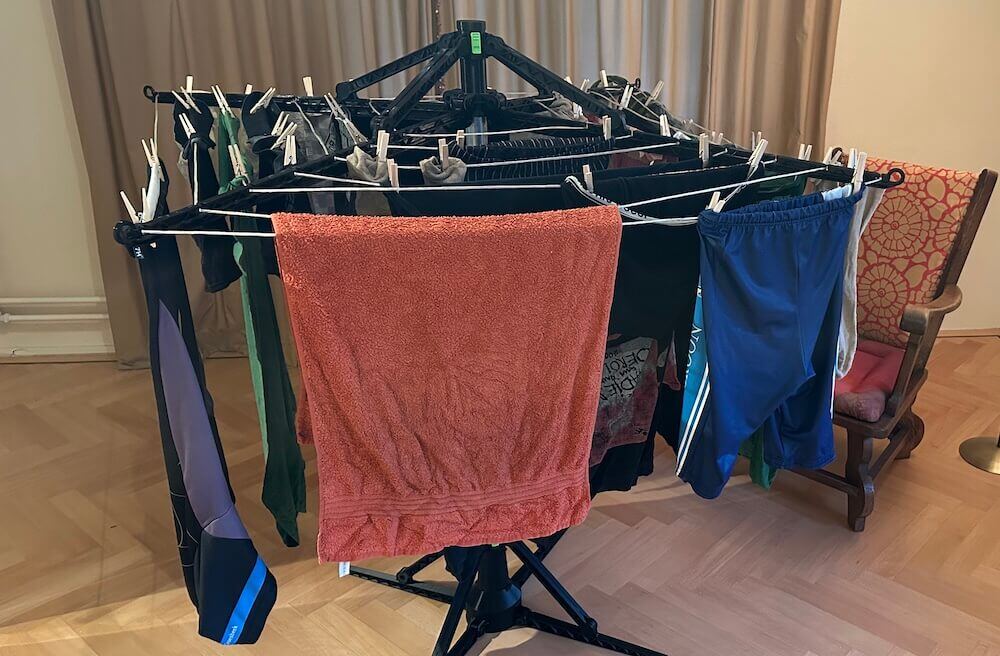 Laundry hanging on an indoor rotary clothesline 