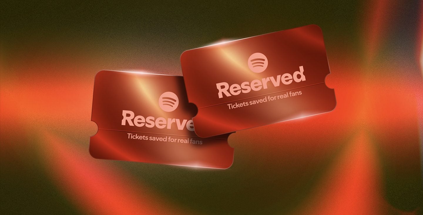 Two metallic red ticket stubs reading 
