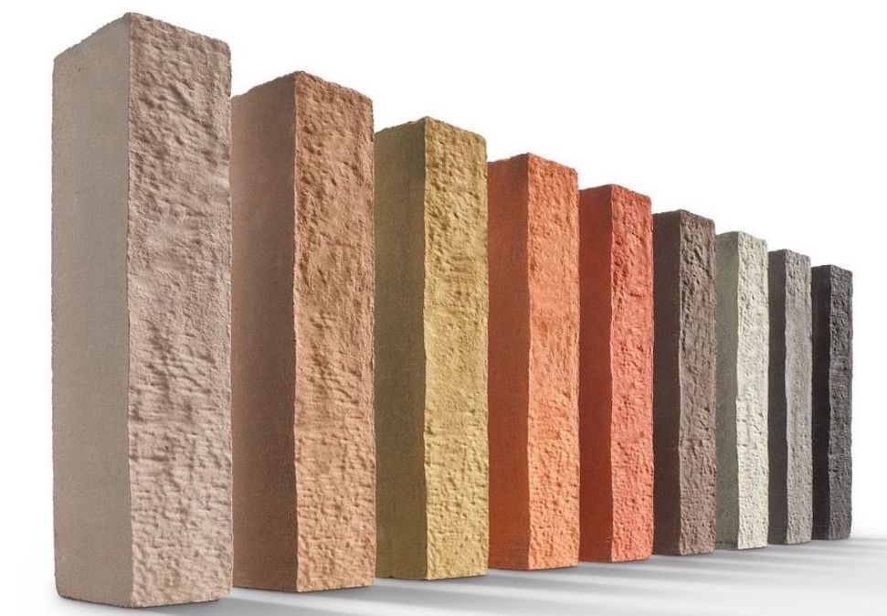 A row of bricks, stood upright, in 9 different colors